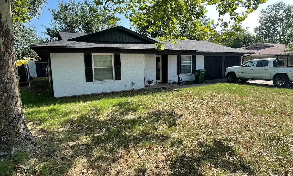 Professional roofing crew working on a residential roof in Harrietstown